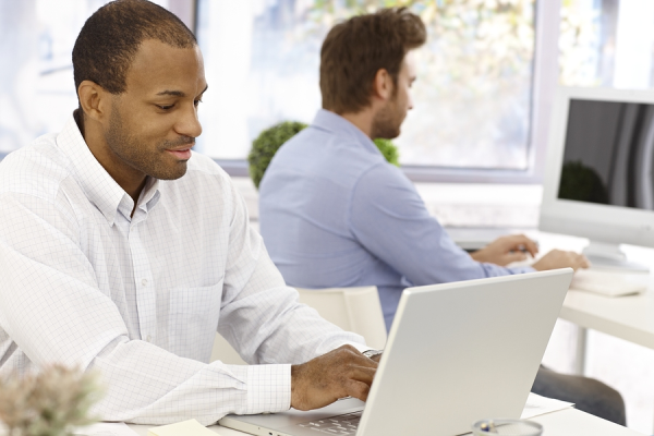Two people working at computers