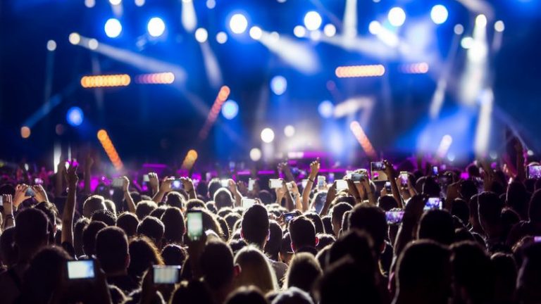 Hand With A Smartphone Records Live Music Festival Taking Photo