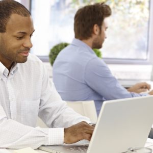 Two people working at computers