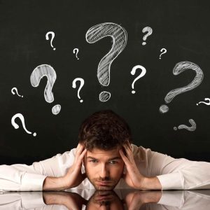 Person looking confused with question marks above their head